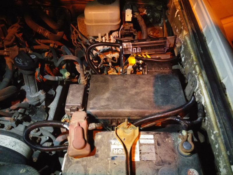 Somewhere in that mess is some 4-gauge cable and a fuse panel...